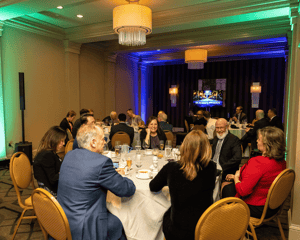 attendees sitting at awards dinner
