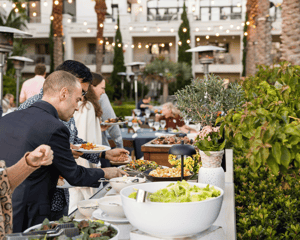 people at a food buffet 