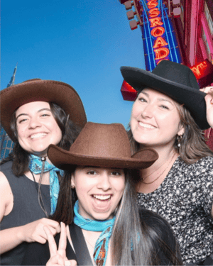 GoGather team with cowboy hats on at an awards dinner in Nashville for a clients conference