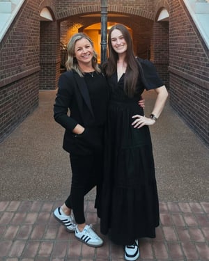 two project managers at a corporate event