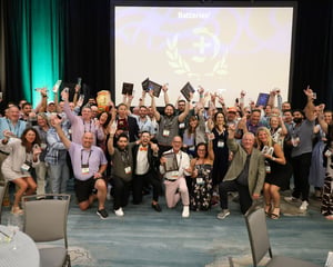 attendees cheering after an awards dinner