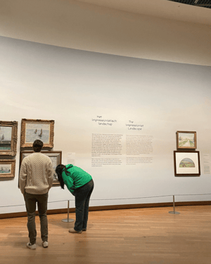 attendees looking at paintings in a musuem in Amsterdam