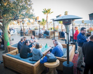 attendees sitting outside venue networking