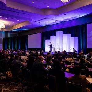 group of attendees watching a conference event