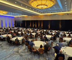 group of attendees watching a conference