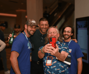 group of event attendees taking a selfie