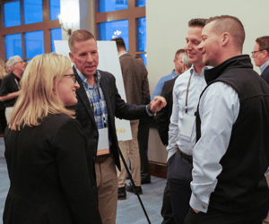 group of attendees networking at a conference