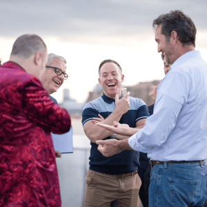 event attendees networking during a conference on a boat