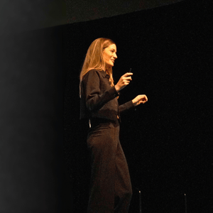 woman giving a presentation during a conference