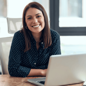 an event planner working with AI on her laptop