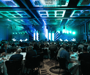 group of attendees watching a corporate conference
