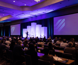 group of attendees watching a corporate conference