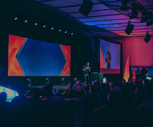 group of attendees watching a corporate conference
