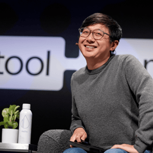 keynote speaker smiling on stage