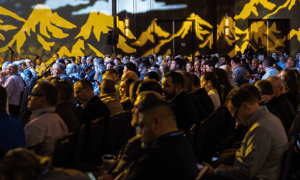 group of attendees watching a presentation at a corporate event