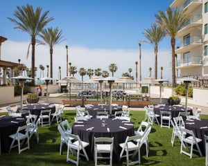 dinner preparation set up outside with plam trees at venue