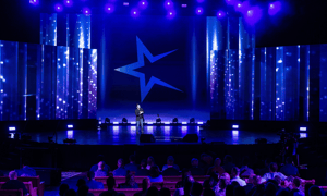 group of attendees watching a corporate conference