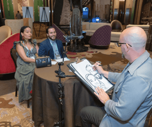 artist painting two attendees