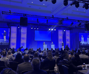 group of attendees watching a global leadership conference
