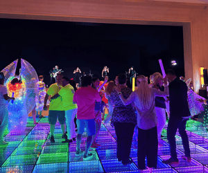 group of attendees dancing during a conference