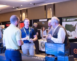 group of attendees talking around a trade show