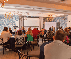 group of attendees watching a presentation
