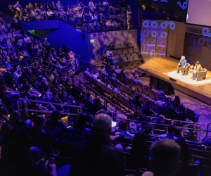 group of attendees watching a conference