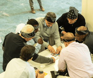 group of attendees doing a scavenger hunt puzzle