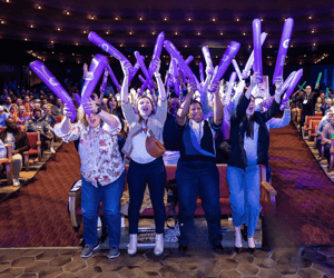 group of attendees celebrating at a sales kickoff