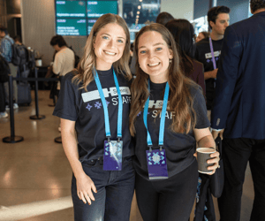 two staff members working at a user conference