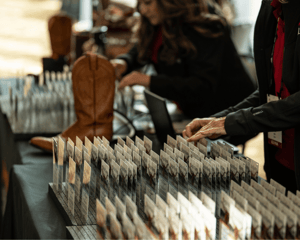 registration name tags lined up with women handing them out 